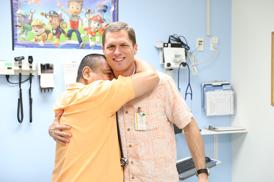 a man hugging a doctor